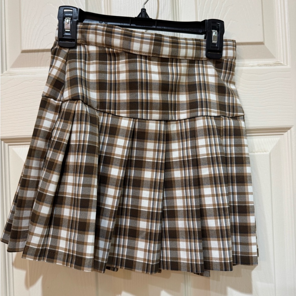 Brown and white girl’s plaid skirt